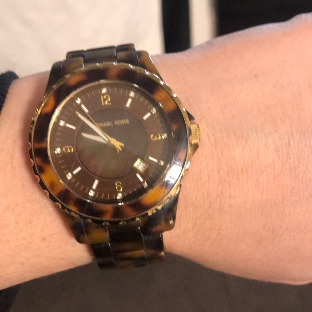 Brown and gold Michael Kors watch.